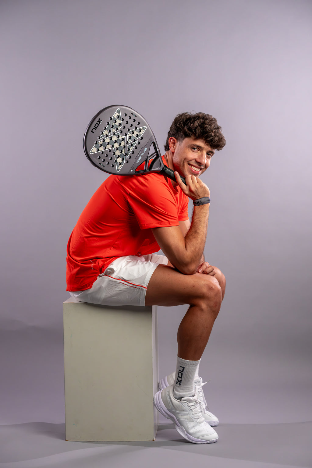 Agustín Tapia holding the NOX Genius 18k Alum (2027) padel racket available in New Zealand from ThePadelShop NZ
