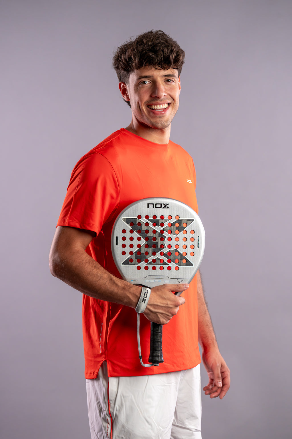 Agustín Tapia holding the NOX Genius 12k Alum Xtrem (2027) padel racket by Agustín Tapia available in New Zealand from ThePadelShopNZ